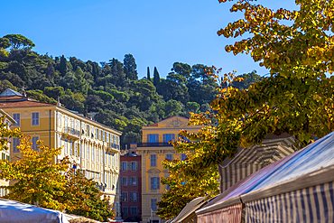 Traditional, colourful buildings above Marche Aux Fleurs (flower market), Cours Saleya, Nice, French Riviera