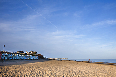 A row of colourful beach-huts on the beach at Southwold in the county of Suffolk, East Anglia.