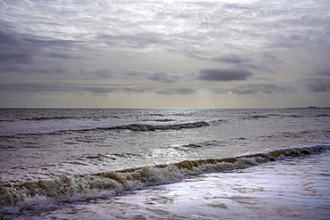 Waves on the shoreline of the North Sea at Southwold beach.