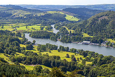 The southern end of Lake Windermere, the largest natural lake in England, viewed from the top of Gummers How hill in the Lake District National Park.
