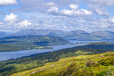 The southern end of Lake Windermere, the largest natural lake in England, viewed from the top of Gummers How hill in the Lake District National Park.