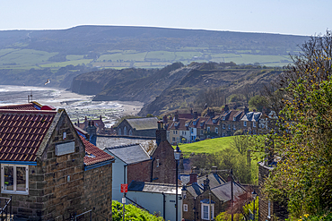 Houses leading down to the coast in the small fishing village of Robin Hood's Bay In the county of Yorkshire.