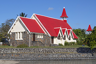 The red-roofed church of Notre-Dame Auxiliatrice at Cap Malheureux on the exotic island of Mauritius in the Indian Ocean