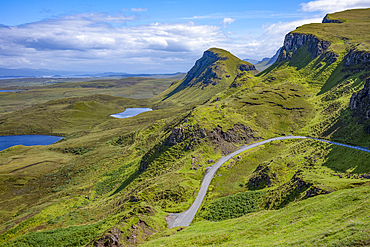 Narrow road running through the rugged hills of the Trotternish escarpment on the northernmost peninsula of the Isle of Skye, Inner Hebrides, Scotland.