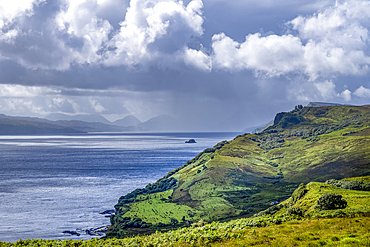 Coastline near the rugged hills of the Trotternish escarpment on the northernmost peninsula of the Isle of Skye, Inner Hebrides, Scotland.