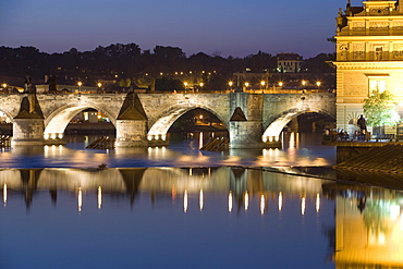 Charles Bridge and Smetana Museum reflected in the River Vltava, Old Town, Prague, Czech Republic, Europe