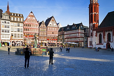 Reconstructed half-timbered buildings and the Gerechtigkeitsbrunnen statue in Romerberg Square, Frankfurt am Main, Hesse, Germany, Europe