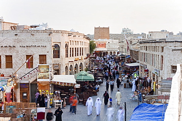 The restored Souq Waqif with mud rendered shops and exposed timber beams, Doha, Qatar, Middle East