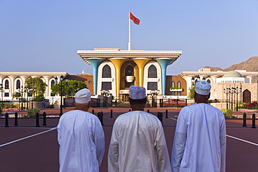 Men looking at the Sultan's Palace, Muscat, Oman, Middle East