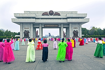 Women in colourful traditional dresses at mass dancing, Pyongyang, Democratic People's Republic of Korea (DPRK), North Korea, Asia