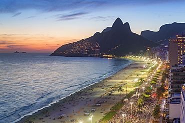 Sunset over Ipanema Beach and Dois Irmaos (Two Brothers) mountain, Rio de Janeiro, Brazil, South America