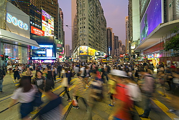 Pedestrians and traffic at a busy road crossing in Causeway Bay, Hong Kong Island, Hong Kong, China, Asia