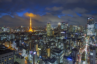 Elevated night view of the city skyline and iconic illuminated Tokyo Tower, Tokyo, Japan, Asia