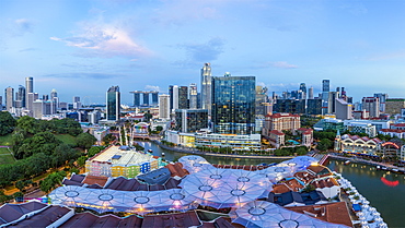 City skyline and riverside restaurants at the entertainment district of Clarke Quay, Singapore, Southeast Asia, Asia