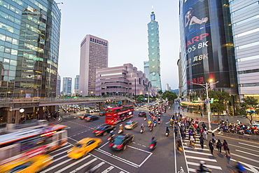 Traffic in front of Taipei 101 at a busy downtown intersection in the Xinyi district, Taipei, Taiwan, Asia