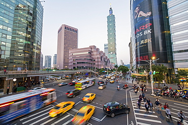 Traffic in front of Taipei 101 at a busy downtown intersection in the Xinyi district, Taipei, Taiwan, Asia