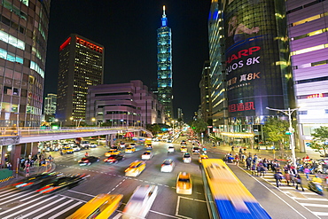 Traffic in front of Taipei 101 at a busy downtown intersection in the Xinyi district, Taipei, Taiwan, Asia