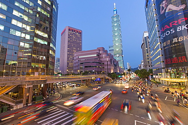 Traffic in front of Taipei 101 at a busy downtown intersection in the Xinyi district, Taipei, Taiwan, Asia