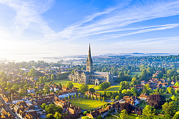 Aerial view over Salisbury and Salisbury Cathedral on a misty summer morning, Salisbury, Wiltshire, England, United Kingdom, Europe