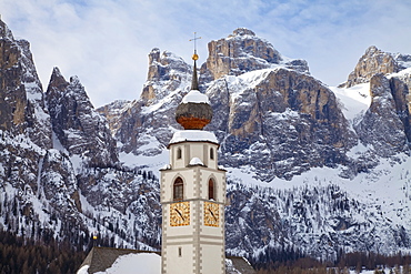 The church and village of Colfosco in Badia, 1645m, and Sella Massif range of mountains under winter snow, Dolomites, South Tirol, Trentino-Alto Adige, Italy, Europe