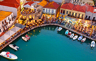 Old Venetian harbour and restaurants at dusk, Rethymno, Crete, Greek Islands, Greece, Europe