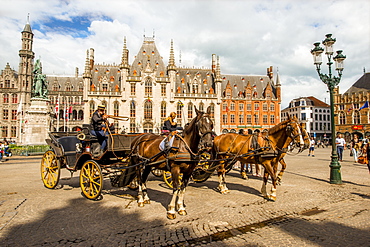 Horse drawn carriage in The Markt (Market Square), Bruges, UNESCO World Heritage Site, West Flanders, Belgium, Europe