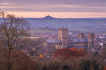 Wells Cathedral and Glastonbury Tor at dawn in winter, Wells, Somerset, England, United Kingdom, Europe