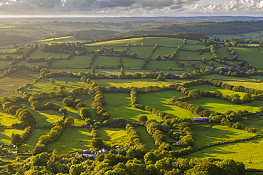 Aerial view by drone of rolling countryside in evening light, Devon, England, United Kingdom, Europe