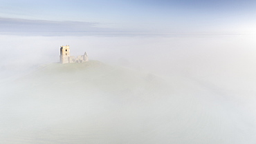 Burrow Mump Church surrounded by morning mist in winter, Burrowbridge, Somerset, England, United Kingdom, Europe