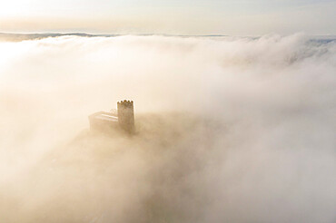 Brentor Church surrounded by morning mist in autumn, Dartmoor, Devon, England, United Kingdom, Europe