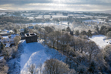 Aerial view of Lydford Castle on a snowy winter morning, Lydford, Devon, England, United Kingdom, Europe