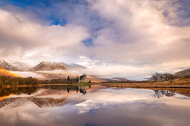 Kilchurn Castle reflected in Loch Awe at dawn in winter, Highlands, Scotland, United Kingdom, Europe