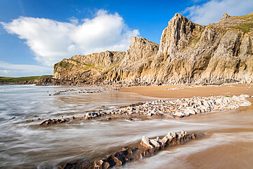 Dramatic cliffs and a deserted beach at the fabulous Mewslade Bay on the Gower Peninsula, Wales, United Kingdom, Europe