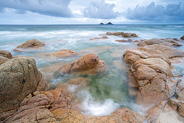 The Brisons islands from the rocky shores of Nanven, near St. Just in Cornwall, England, United Kingdom, Europe