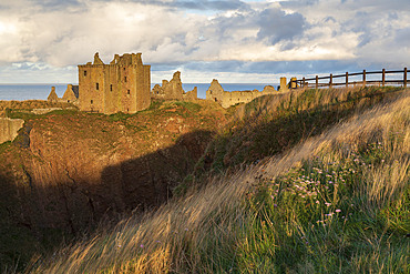 Dunnottar Castle perched on a cliff top promontory south of Stonehaven, Aberdeenshire, Scotland, United Kingdom, Europe