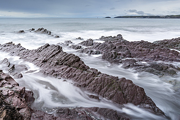 Stormy seas over rocky shores of Downderry Beach, in spring, Cornwall, England, United Kingdom, Europe