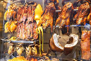 Duck and pork hanging up in window of restaurant, Central, Hong Kong Island, Hong Kong