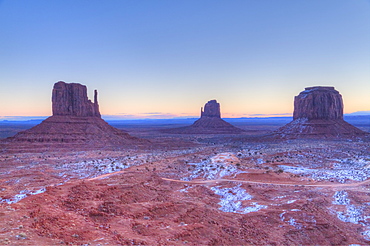 Sunrise, West Mitten Butte on left, East Mitten Butte in centre, and Merrick Butte on right, Monument Valley Navajo Tribal Park, Utah, United States of America, North America