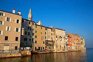 Buildings on the waterfront and Tower of Church of St. Euphemia behind, Old Town, Rovinj, Croatia, Europe