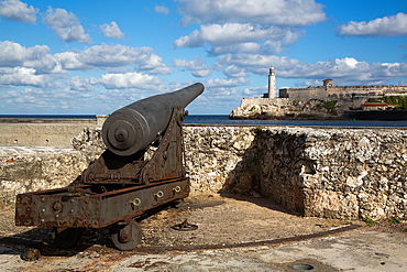 Centuries Old Cannon, Castillo Del San Salvador (foreground), Castillo Morro (background), Havana Old Town, Havana, Cuba