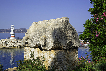 Lycian Sarcophogus (foreground), Kas Marina Lighthouse, Kas, Antalya, Turkey