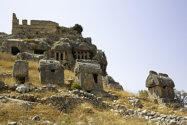 Sarcophagai, 4th century BC - 3rd century AD, Rock Tombs (background), Tlos, Ancient Lycian City, Mugla Province, Turkey