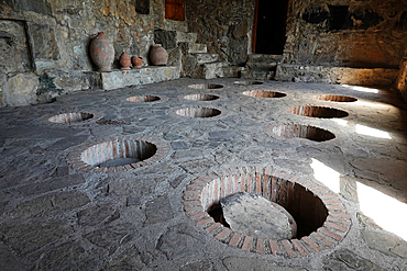 Kvevri, large earthenware vessels used for the fermentation and storage of traditional Georgian wine.