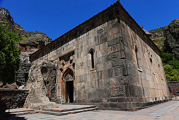 Geghard monastery, a medieval monastery in the Kotayk province of Armenia, is partially carved out of the adjacent mountain and is a UNESCO World Heritage Site. The main chapel was built in 1215, but the monastery complex was founded in the 4th century.