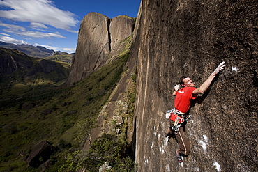 A climber on a very difficult route on the cliffs of the Tsaranoro Massif, Southern Madagascar, Africa