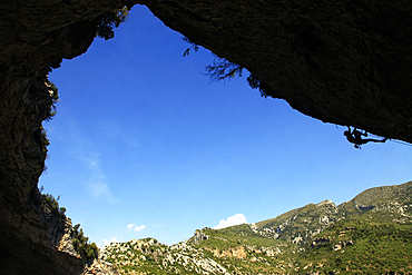 A climber tackles an overhanging climb in the Mascun canyon, Rodellar, Aragon, Spain, Europe