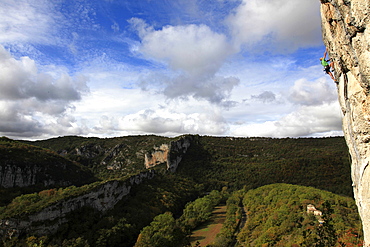 A climber scales cliffs in the Aveyron region, southwest France, Europe