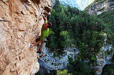 A climber scales cliffs near Bielsa, Pyrenees, northern Spain, Europe