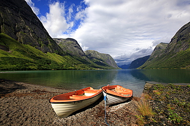 Boats pulled up by a fjord, Songdal region, near Bergen, western Norway, Scandinavia, Europe