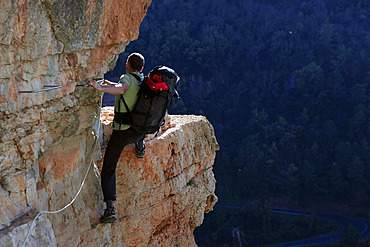 A climber scaling a Via Ferrata at Siurana, Catalonia, Spain, Europe